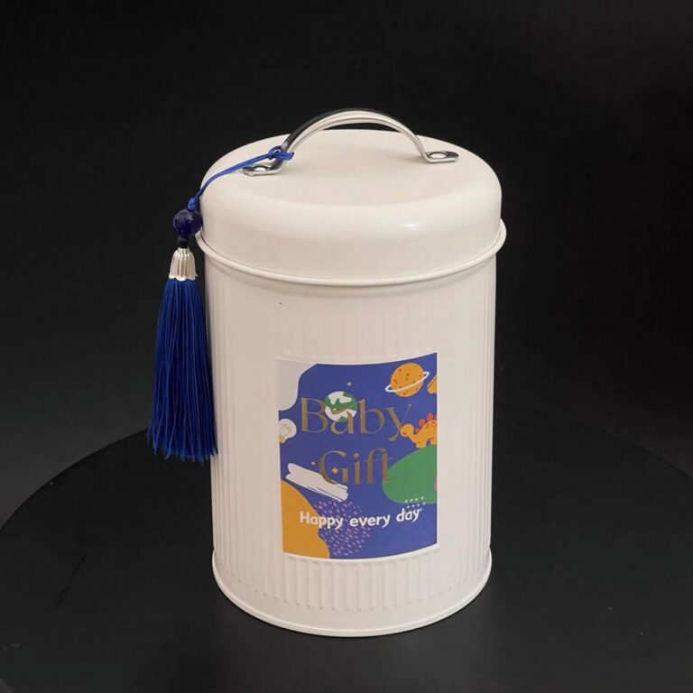 Tin Box Round tinplate can with vertical ribbed finish, handle, and tassel.